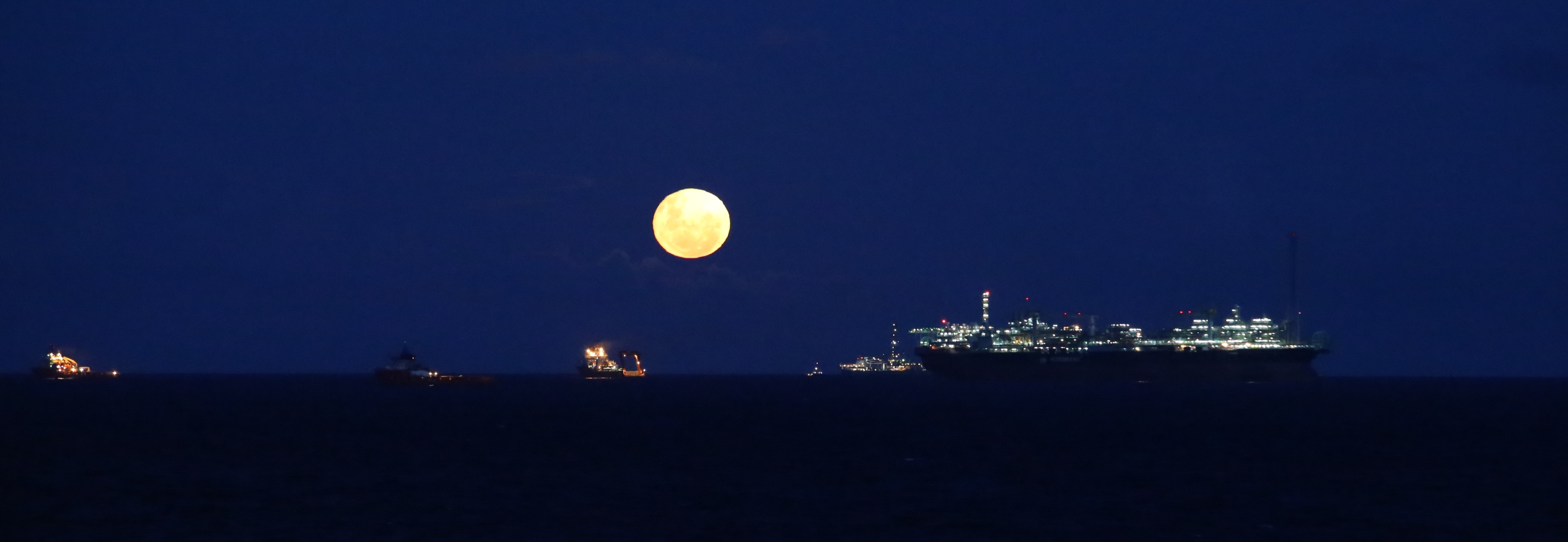 Full moon at the Campus Basin Oil Field in Brazil. 